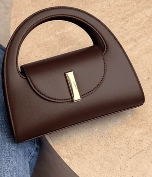 Terra Arc Clutch in matte bio calf with an integrated arc handle